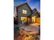 Outdoor patio features dark metal furniture and a built-in grill on stamped concrete and is ready for relaxation at 2042 S Clayton St, Denver, CO 80210