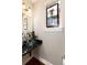 Chic bathroom with a decorative stained glass window and a unique glass vessel sink on a dark countertop at 2042 S Clayton St, Denver, CO 80210