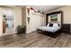 Bedroom with sleek flooring, a Murphy bed, closet, and decorative sport pennants at 2042 S Clayton St, Denver, CO 80210