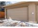 Detached two car garage featuring a concrete driveway and new garage doors at 2042 S Clayton St, Denver, CO 80210