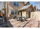 Back patio with a large outdoor table and chairs, ideal for entertaining and outdoor dining at 2042 S Clayton St, Denver, CO 80210