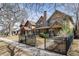 Charming neighborhood street featuring craftsman style homes, mature trees and sidewalks at 2042 S Clayton St, Denver, CO 80210