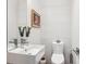 Clean and modern bathroom with white tile and a contemporary vanity at 3048 Stout St, Denver, CO 80205