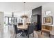 Stylish dining room features a unique round table and modern light fixture at 3048 Stout St, Denver, CO 80205