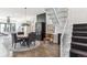 Modern dining area with round table and view into the kitchen at 3048 Stout St, Denver, CO 80205