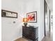 Elegant entryway with dark wood console table and framed artwork at 3048 Stout St, Denver, CO 80205