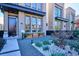 Contemporary townhome boasts a charming front yard with gravel pathway at 3048 Stout St, Denver, CO 80205