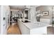 Modern kitchen boasts a large island with marble countertops and high-end appliances at 3048 Stout St, Denver, CO 80205