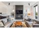 Spacious living room features a modern fireplace and large TV at 3048 Stout St, Denver, CO 80205