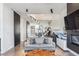 Bright and airy living room with a modern staircase and open floor plan at 3048 Stout St, Denver, CO 80205