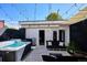 Outdoor oasis with hot tub, seating area, and string lights at 3048 Stout St, Denver, CO 80205