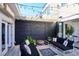 Private patio with seating area, fire pit, and string lights at 3048 Stout St, Denver, CO 80205