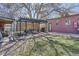 Cozy backyard featuring a pergola with seating and lush garden at 3456 Quivas St, Denver, CO 80211