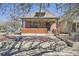 Charming home with a brick facade, covered porch, and landscaped front yard, creating curb appeal at 3456 Quivas St, Denver, CO 80211