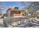 Charming single-Gathering home with a brick facade and covered porch, complemented by mature trees at 3456 Quivas St, Denver, CO 80211