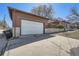 Spacious garage with a driveway and easy street access for parking and convenience at 3456 Quivas St, Denver, CO 80211