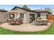 Charming patio with comfortable seating, dining set, and string lights, perfect for outdoor entertaining at 9790 E 5Th Ave, Aurora, CO 80010