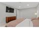 Well-lit bedroom with hardwood furniture, cozy duvet, and recessed lighting at 9790 E 5Th Ave, Aurora, CO 80010