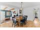 Open dining area with hardwood floors, leading into living space, perfect for Gathering meals and entertaining at 9790 E 5Th Ave, Aurora, CO 80010