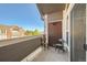 Relax on this condo's charming balcony with chairs, offering views of the neighborhood at 14221 E 1St Dr # 303, Aurora, CO 80011