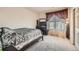Bedroom features a plush carpet, a bed, closet, and a window with decorative curtains at 14221 E 1St Dr # 303, Aurora, CO 80011