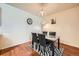 A dining room featuring a marble table, black chairs, a zebra rug and decorative lighting at 14221 E 1St Dr # 303, Aurora, CO 80011