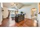 Inviting living room with vaulted ceilings, hardwood floors, and sliding doors to a balcony at 14221 E 1St Dr # 303, Aurora, CO 80011