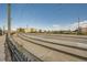 A modern commuter train travels along train tracks near commercial buildings and a blue sky at 14221 E 1St Dr # 303, Aurora, CO 80011