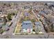 An aerial view showing this property's roof, landscaping, and neighborhood, close to the street at 3504 Newton St, Denver, CO 80211