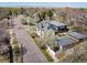 An aerial view showing this property's roof, landscaping, and neighborhood, close to the street at 3504 Newton St, Denver, CO 80211