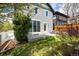 Backyard with patio and lawn, perfect for outdoor entertaining and relaxation on warm days at 3504 Newton St, Denver, CO 80211