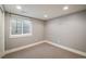Finished basement with carpet and window at 3504 Newton St, Denver, CO 80211