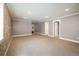 Finished basement with carpet floors and exposed brick accent wall at 3504 Newton St, Denver, CO 80211
