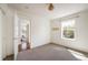 Bright, empty bedroom with hardwood floors and large windows at 3504 Newton St, Denver, CO 80211