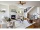 Bright living room features fireplace, hardwood floors, and a cozy atmosphere at 3504 Newton St, Denver, CO 80211