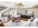 Open-concept living room flows into the kitchen, featuring hardwood floors and a seamless design at 3504 Newton St, Denver, CO 80211