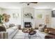 Bright living room with a fireplace, hardwood floors, and tasteful decor creates a welcoming space at 3504 Newton St, Denver, CO 80211
