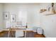Bright office space featuring hardwood floors, natural light, and a glass desk at 3504 Newton St, Denver, CO 80211