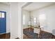 Bright office space featuring hardwood floors, natural light, and a glass desk at 3504 Newton St, Denver, CO 80211