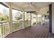 Inviting covered porch with wood flooring, white railings, and serene neighborhood views at 3504 Newton St, Denver, CO 80211