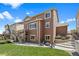 Backyard with a well-manicured lawn, a patio with seating, and an outdoor fire pit for relaxation at 20855 Park Hollow Dr, Parker, CO 80138