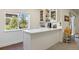 Stylish home bar featuring white cabinetry, a countertop, and a window offering a view of the neighborhood at 20855 Park Hollow Dr, Parker, CO 80138