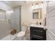 Modern bathroom featuring a glass-enclosed shower, marble vanity, and sleek lighting fixtures at 20855 Park Hollow Dr, Parker, CO 80138