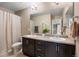 Primary bathroom with double vanity, shower-tub, and neutral wall color creating a relaxing spa-like atmosphere at 20855 Park Hollow Dr, Parker, CO 80138