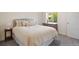 Serene bedroom with a cushioned headboard, a window with tree views, and a dresser for clothing storage at 20855 Park Hollow Dr, Parker, CO 80138