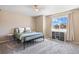 Cozy bedroom featuring a metal bed frame, plush pillows, and a window with neighborhood views at 20855 Park Hollow Dr, Parker, CO 80138