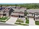 Aerial view of a two-story home with a three-car garage and a beautifully landscaped front yard at 20855 Park Hollow Dr, Parker, CO 80138