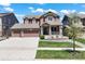Charming two-story home with a three-car garage, covered porch, and well-maintained front yard at 20855 Park Hollow Dr, Parker, CO 80138