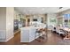 Bright, modern kitchen with a large island, stainless steel appliances, and an adjacent dining area at 20855 Park Hollow Dr, Parker, CO 80138