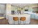 Spacious kitchen with a quartz island, stainless steel appliances, and light blue cabinets at 20855 Park Hollow Dr, Parker, CO 80138